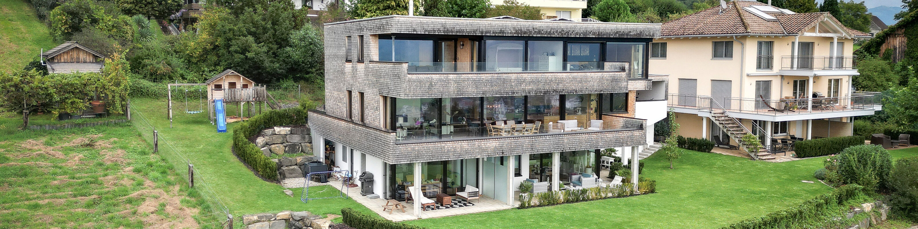 Einfamilienhaus mit Einliegerwohnung in Vollholz-Bauweise in Liechtenstein - Thoma Holz100
